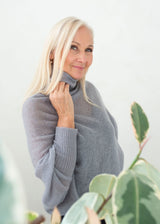 Asymmetric mohair sweater with a turtle neck