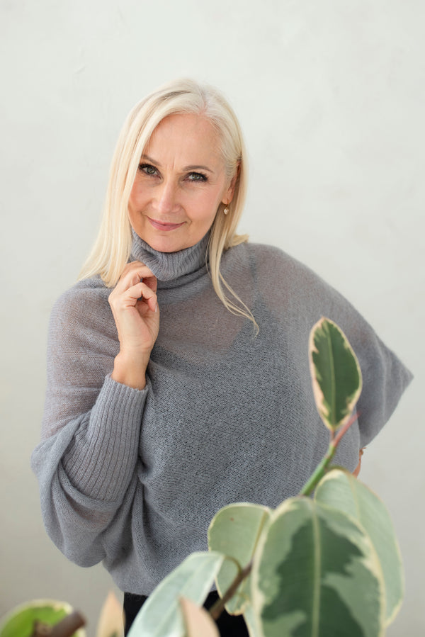 Asymmetric mohair sweater with a turtle neck