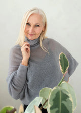 Asymmetric mohair sweater with a turtle neck