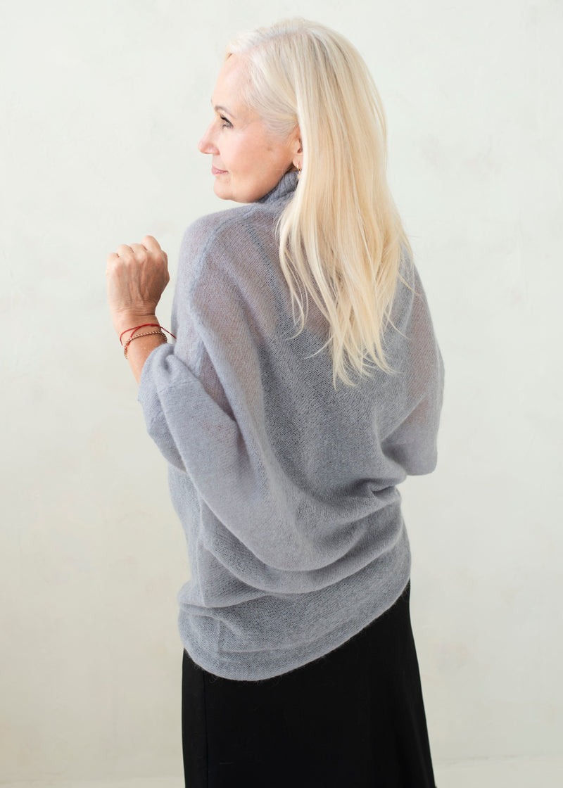 Asymmetric mohair sweater with a turtle neck