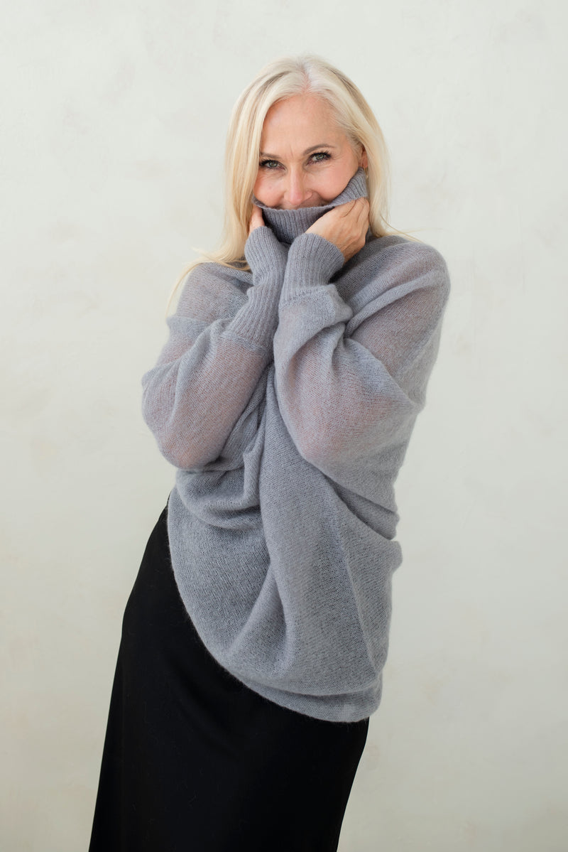 Asymmetric mohair sweater with a turtle neck