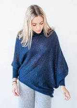 Asymmetric mohair sweater with a turtle neck