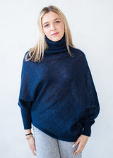 Asymmetric mohair sweater with a turtle neck