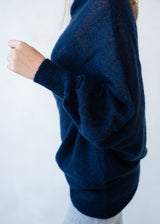 Asymmetric mohair sweater with a turtle neck