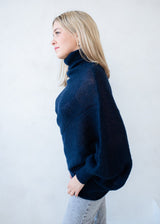 Asymmetric mohair sweater with a turtle neck