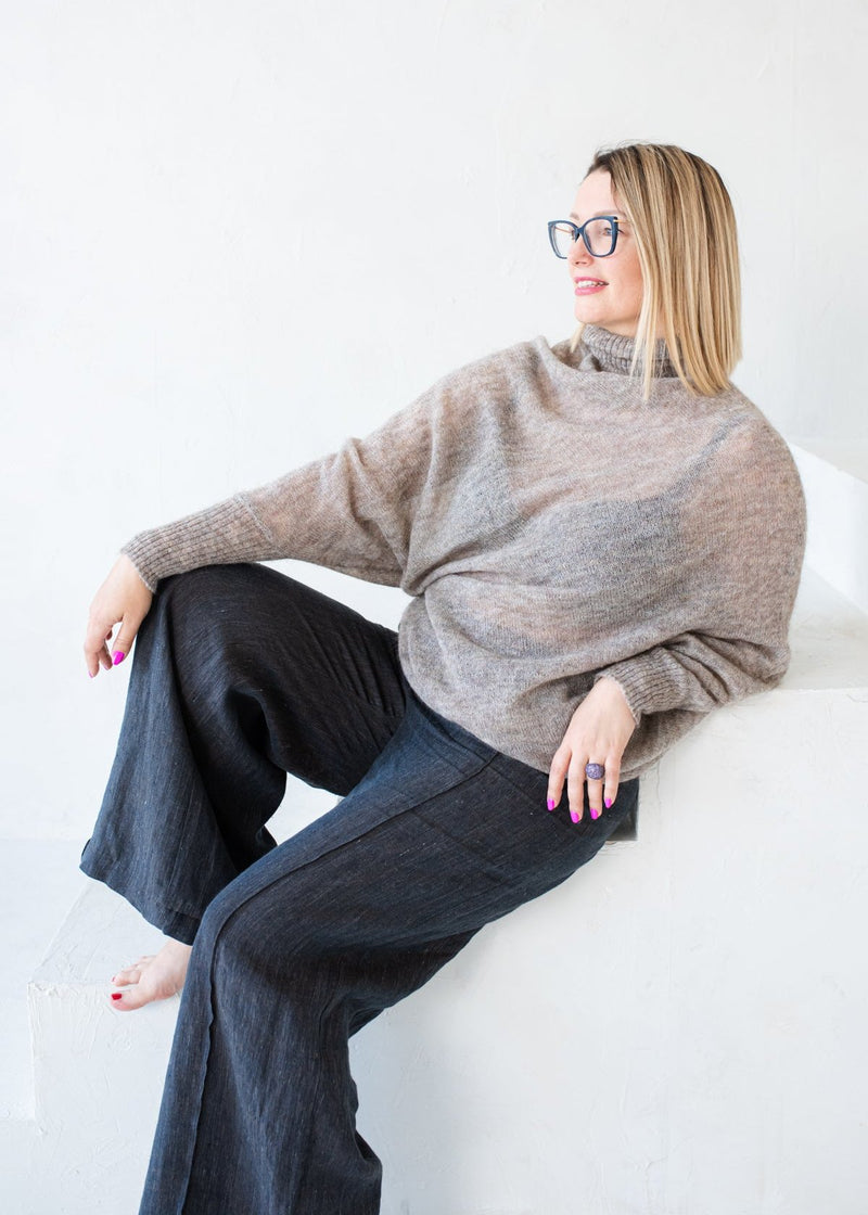 Asymmetric mohair sweater with a turtle neck