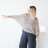 Asymmetric mohair sweater with a turtle neck