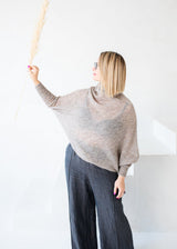 Asymmetric mohair sweater with a turtle neck