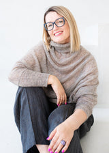 Asymmetric mohair sweater with a turtle neck