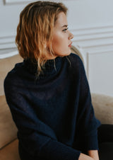 Asymmetric mohair sweater with a high collar