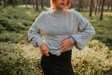 Light gray alpaca wool sweater with raised sleeves